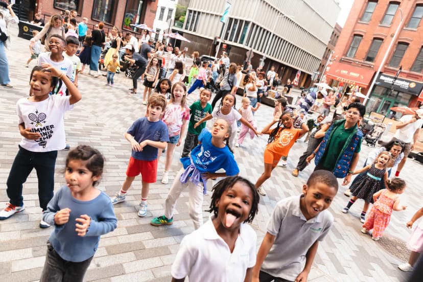 Kids dancing on the plaza at an outdoor disco in Dumbo