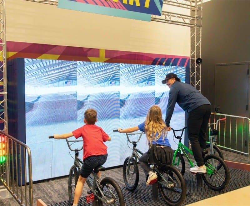 Kids on BMX bikes in the Riders Ready exhibit at Brooklyn Children’s Museum