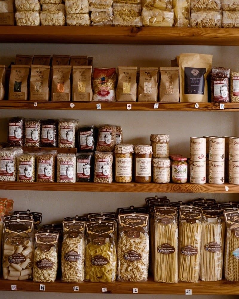 Pasta and heirloom beans on the shelves at First Bloom, Alison Roman’s grocery store